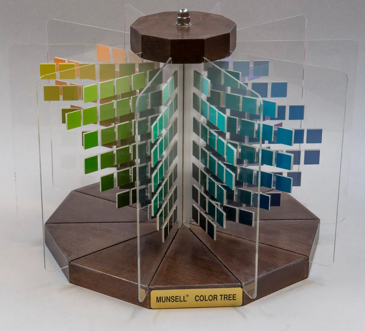 Albert Munsell's three dimensional color tree, arranging painted chips by hue, lightness, and chroma on separate axes.